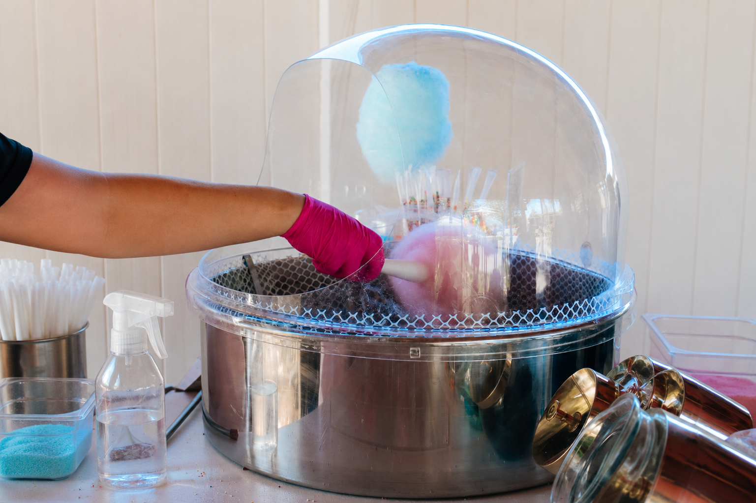 Cotton candy machine spinning pastel floss at an event